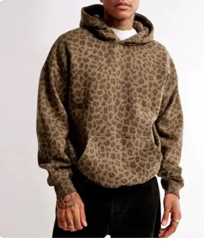 Person wearing a leopard print hoodie on a white background