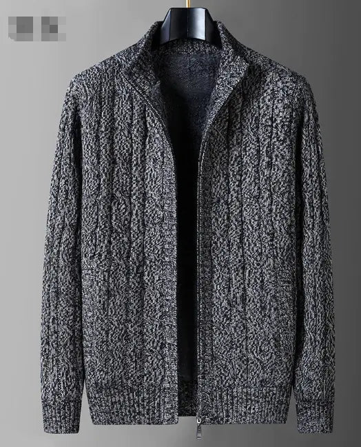 Gray cable knit sweater on a mannequin against a gray background