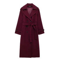 Maroon trench coat on a white background