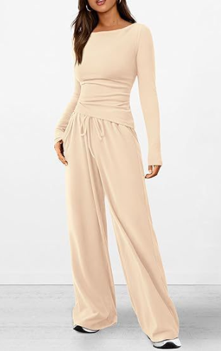 Beige jumpsuit worn by a model on a white background