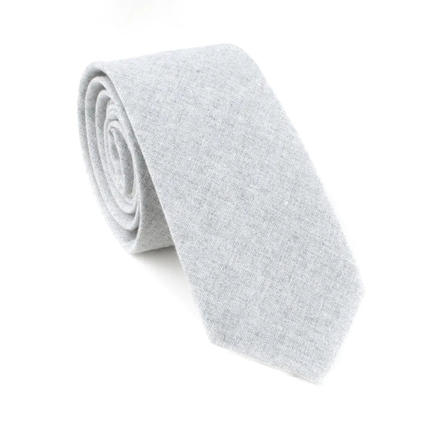 Rolled-up light gray tie on a white background