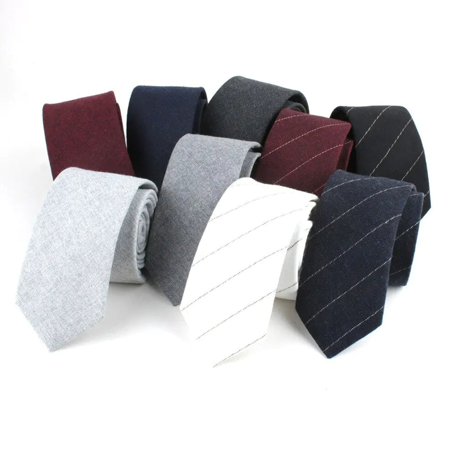 Set of various ties in different colors and patterns on a white background