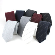Set of various ties in different colors and patterns on a white background