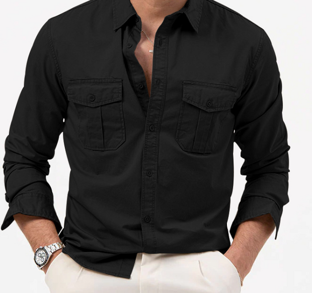 Black button-up shirt with rolled-up sleeves worn by a person on a white background