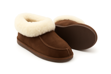 Pair of brown slippers with white fur lining on a white background
