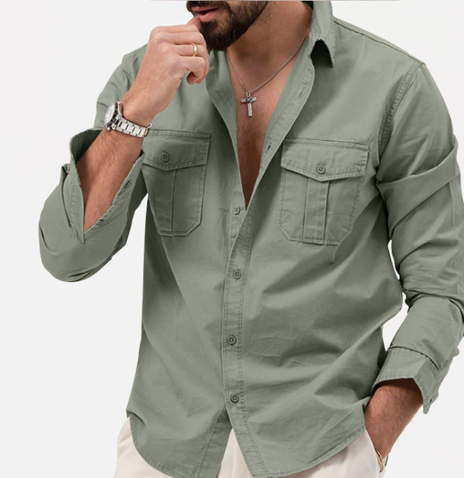 Man wearing a green shirt with rolled-up sleeves on a white background