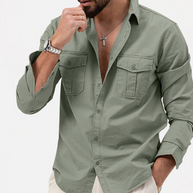 Man wearing a green shirt with rolled-up sleeves on a white background