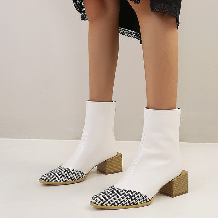 White ankle boots with houndstooth patterned toes on a neutral background