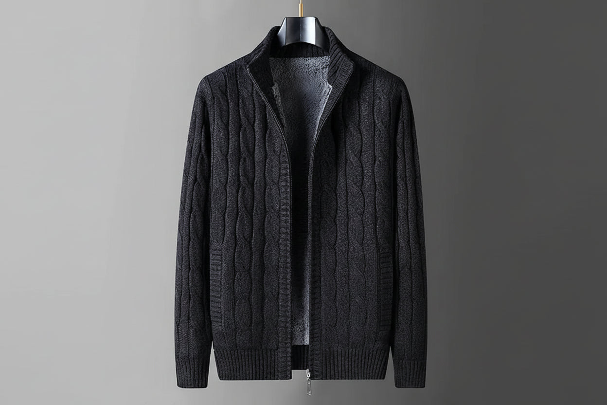 Dark gray cable knit sweater on a hanger with flame graphic indicating thick fleece lining.