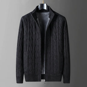Dark gray cable knit sweater on a hanger with flame graphic indicating thick fleece lining.