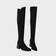 Black knee-high boots on a light gray background