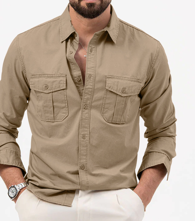 Man wearing a beige button-up shirt with rolled-up sleeves on a white background