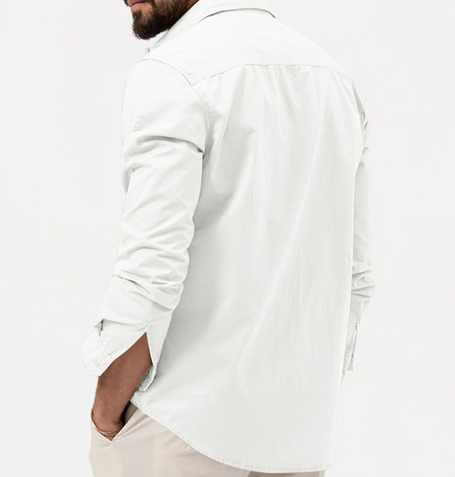 Person wearing a white long-sleeve shirt on a plain background